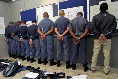 looted scandal|South African police make arrests over notorious bank corruption.